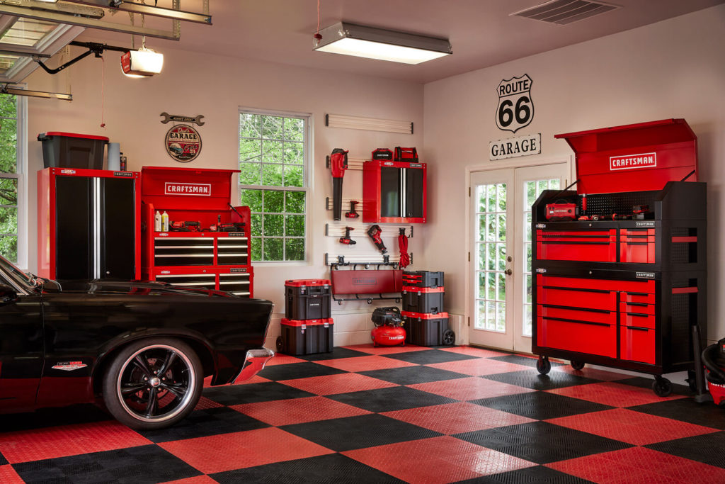 garage equiped with craftsman tools cabinets and garage door opener