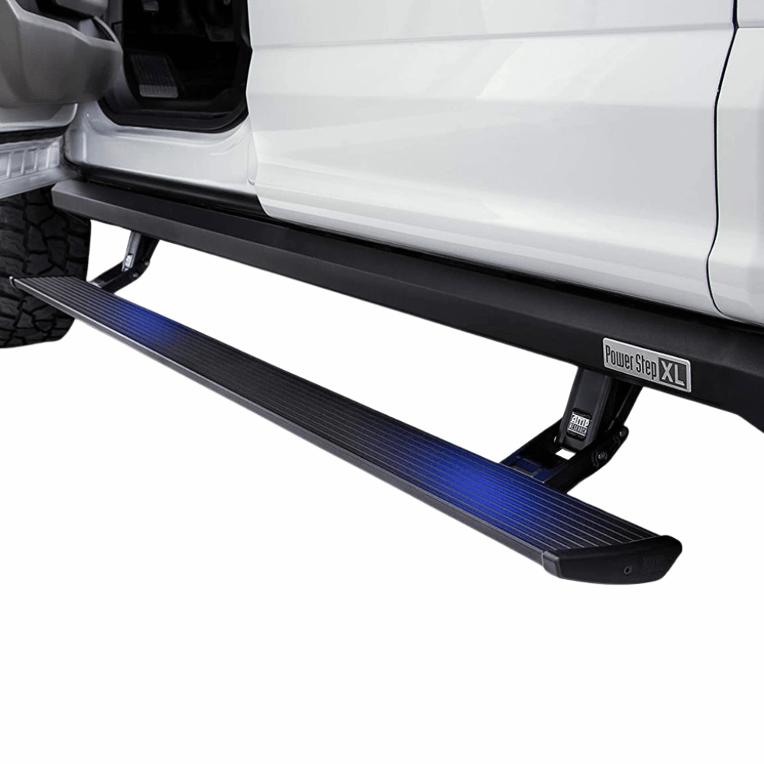 AMP Research PowerStep XL deployed below a white pickup truck
