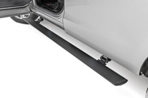 Rough Country electric running board deployed on a truck
