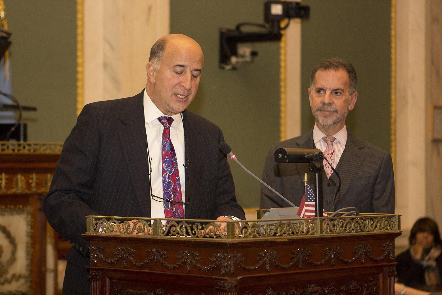 Speakers at a city council meeting