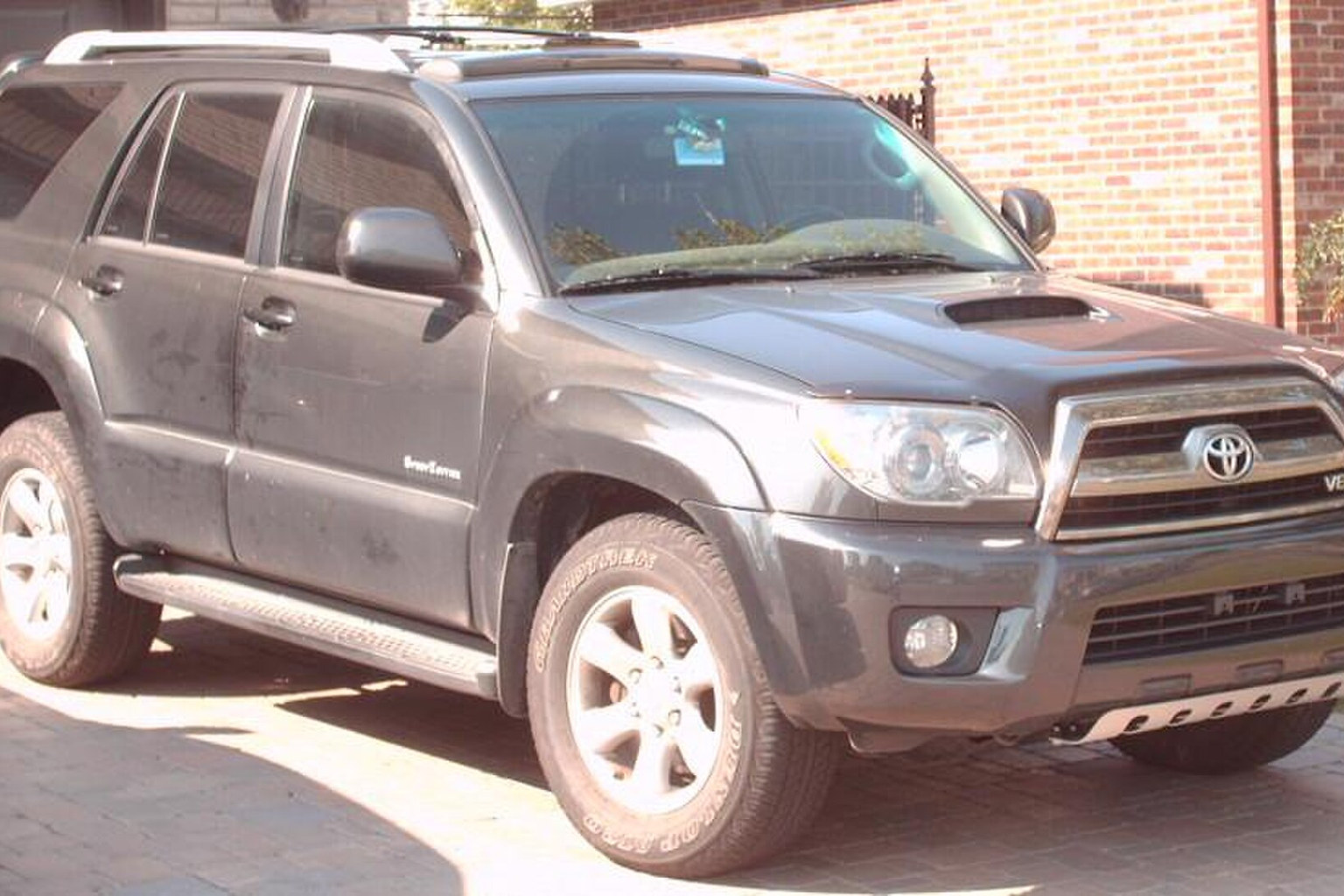 Gray Toyota 4Runner SUV with side steps