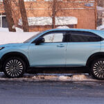 Blue Honda SUV shown in side profile