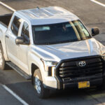 White Toyota Tundra pickup truck with side steps