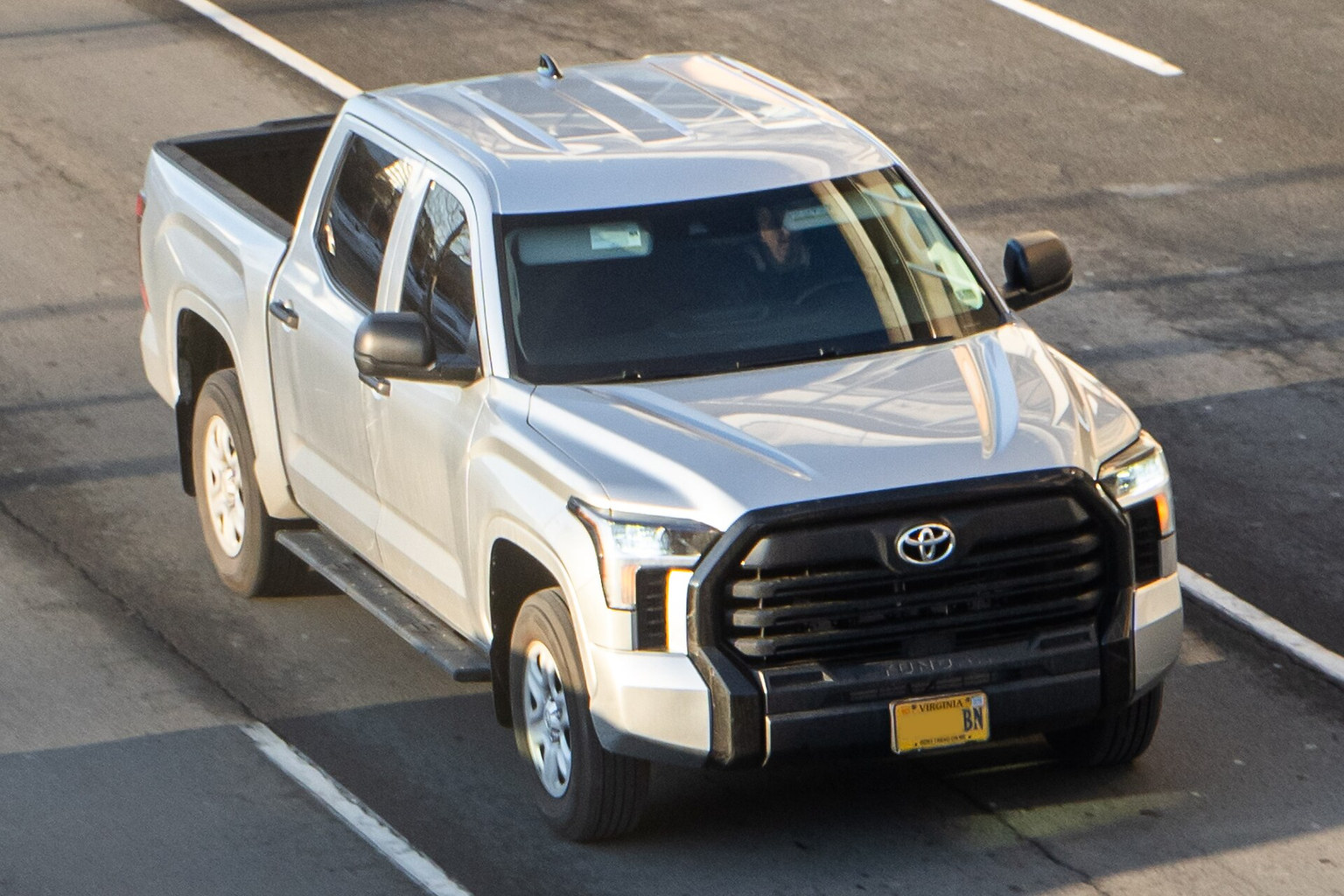 White Toyota Tundra pickup truck with side steps